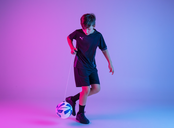 Children practicing football with the SenseBall all-level kick trainer